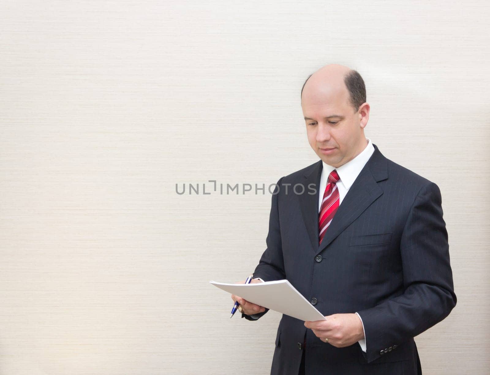 Business man reading a document.