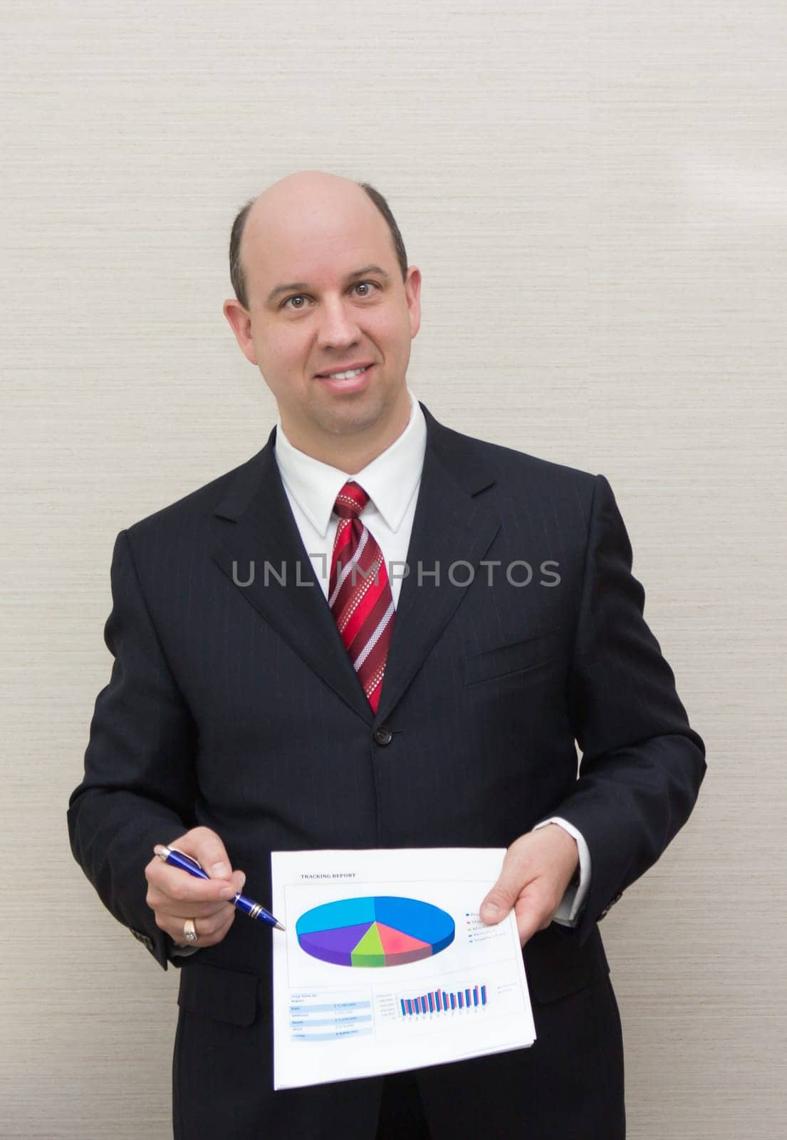 Business man showing a document.