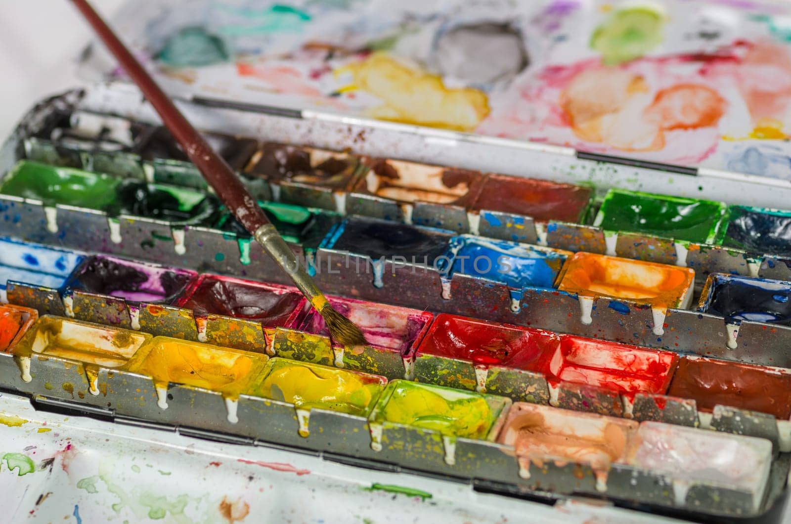 Watercolor paint box with brush