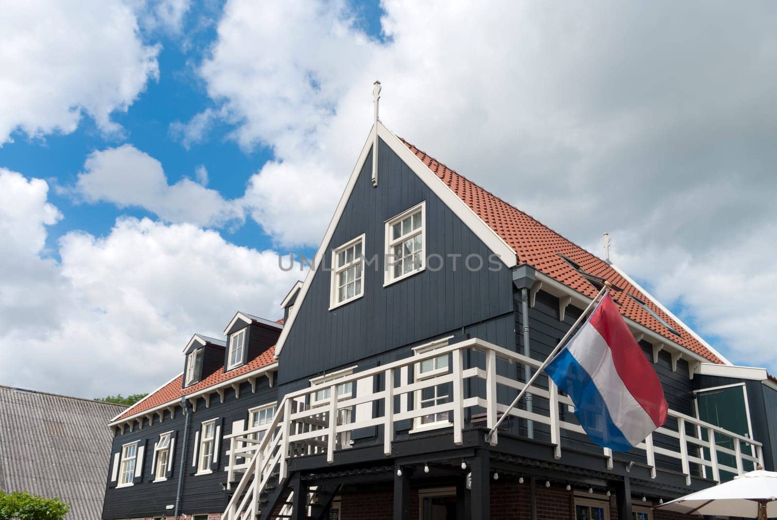 traditional wooden house with dutch flag in Marken, Netherlands