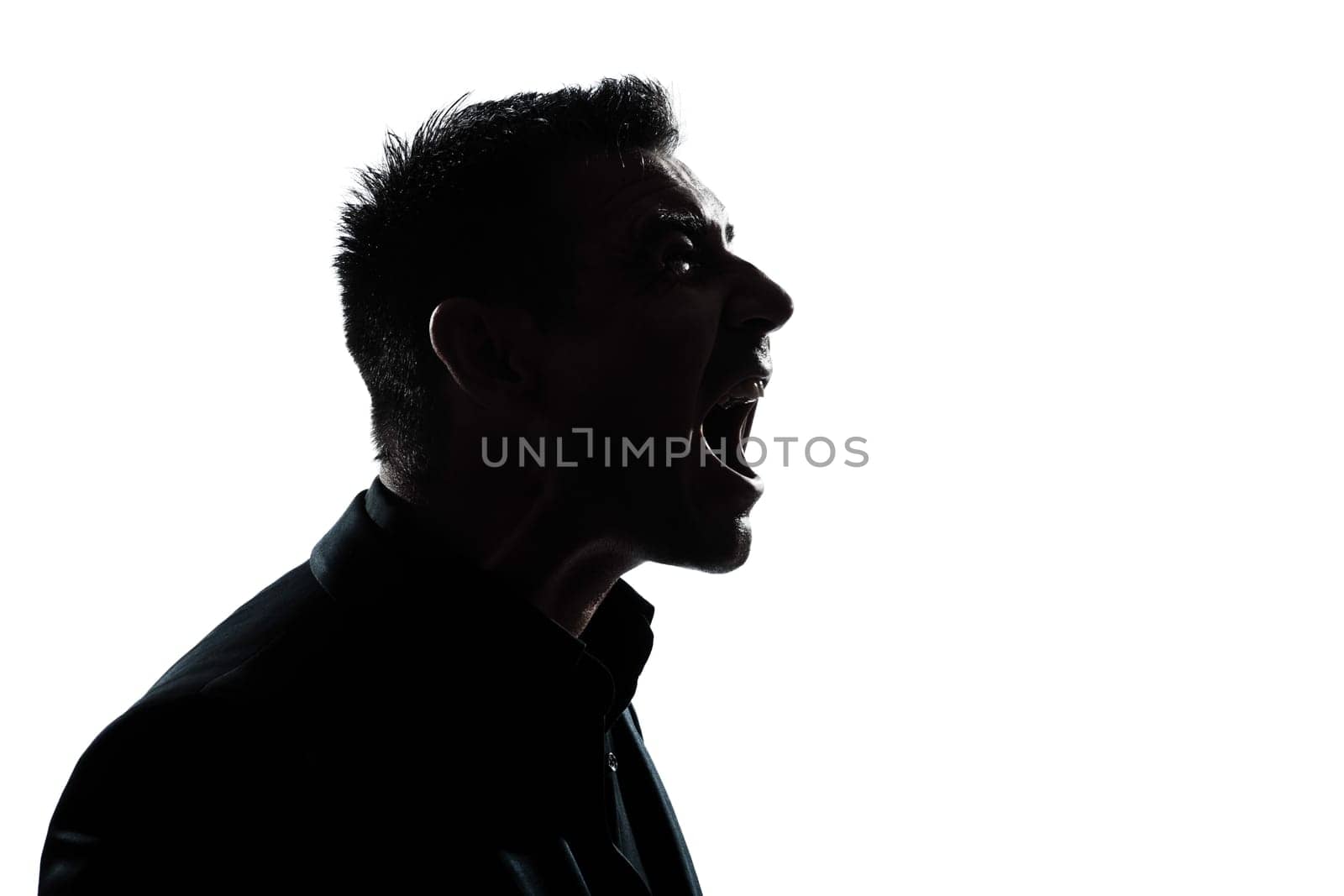 one caucasian man portrait silhouette profile screaming angry in studio isolated white background