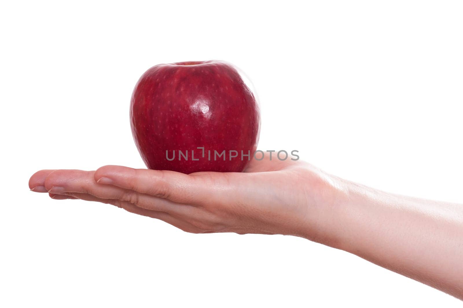White isolated red apple on a female hand