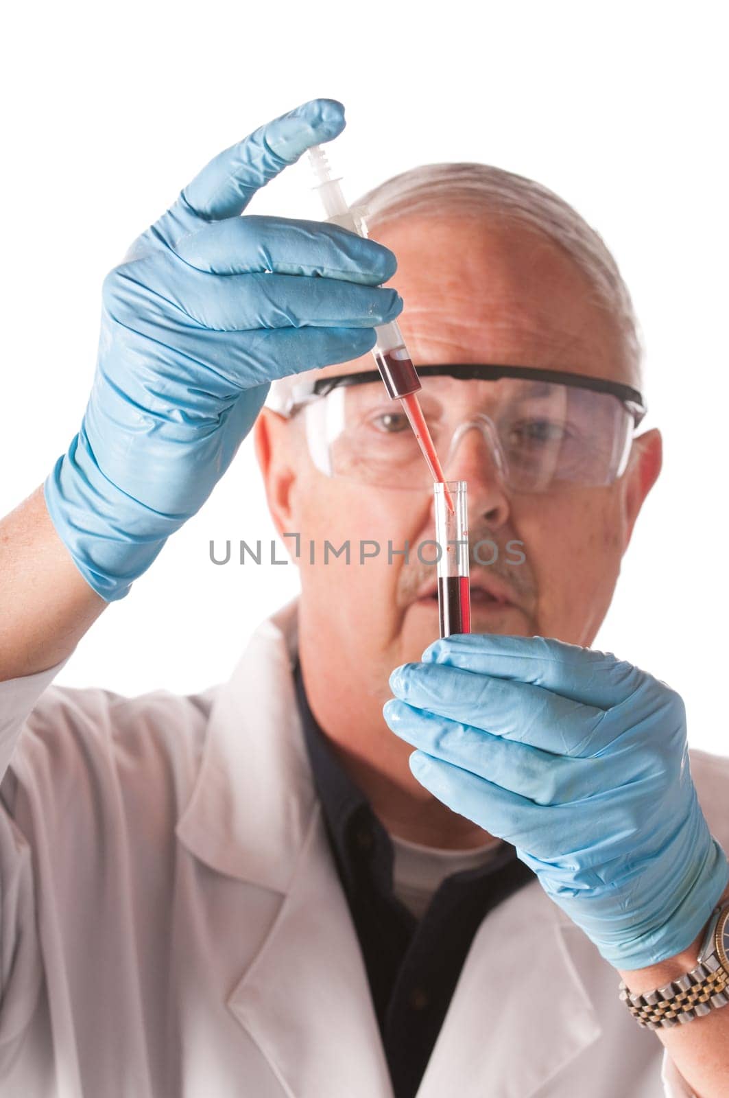 Research scientist with blood samples and culture dish for analysis