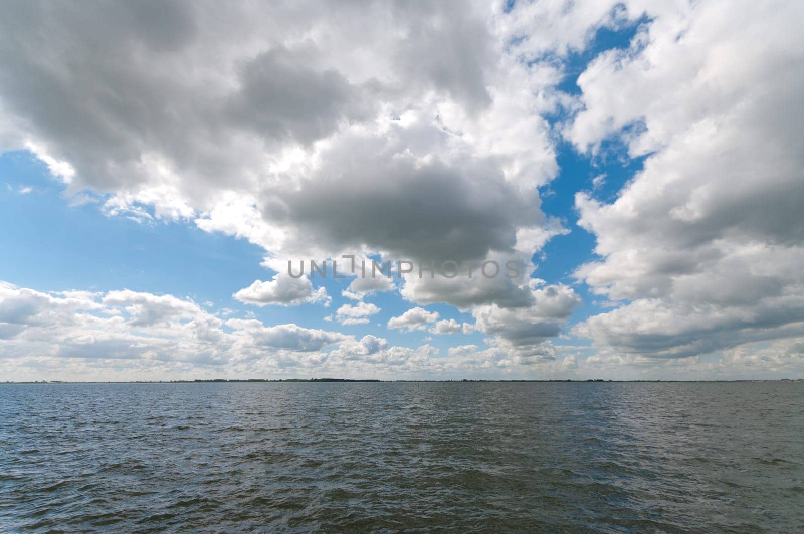 nice cloudy sky over the IJsselmeer, a lake in the Netherlands