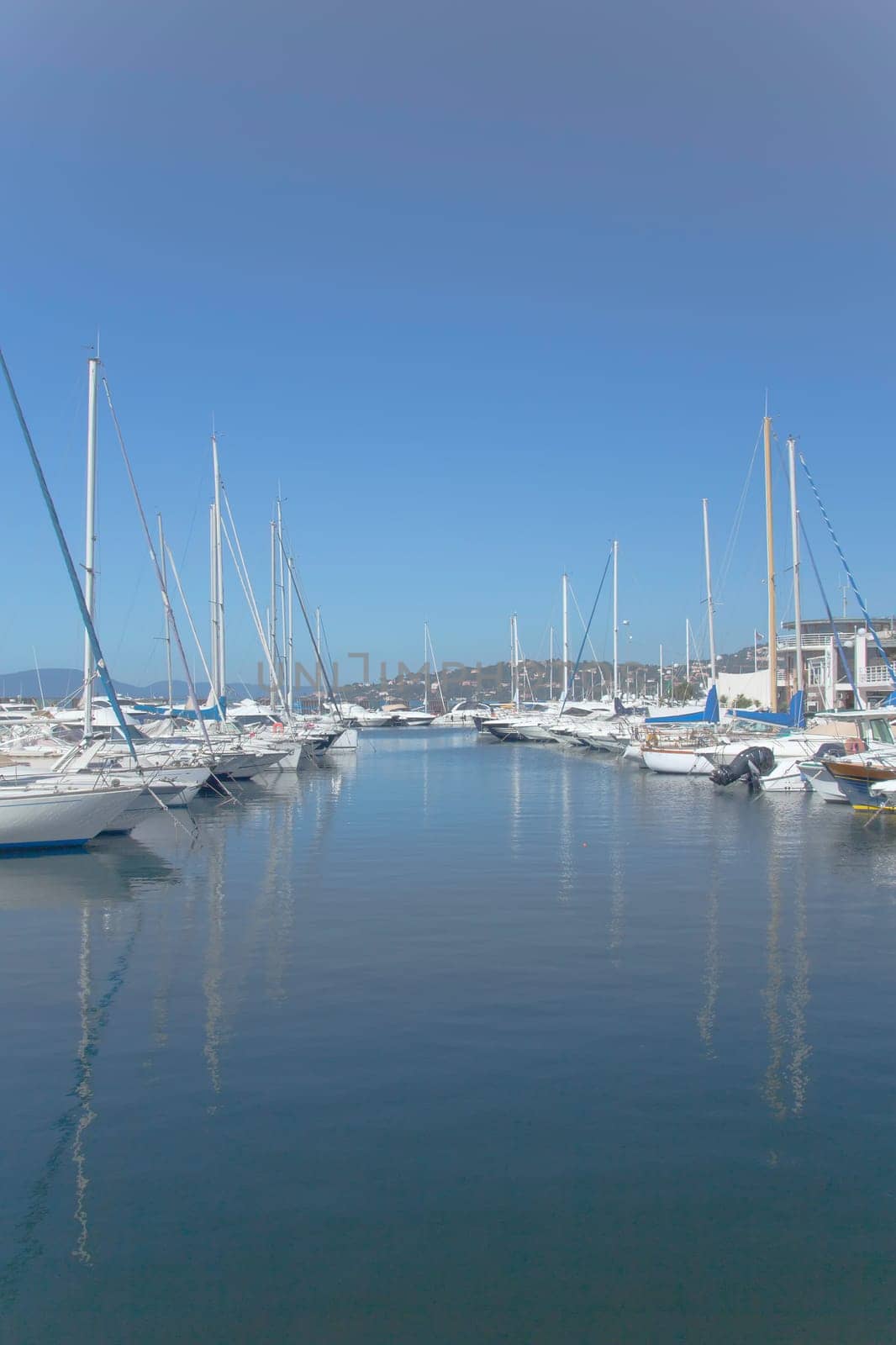 Sailboats and yachts in a quiet harbor ocean marina (France)