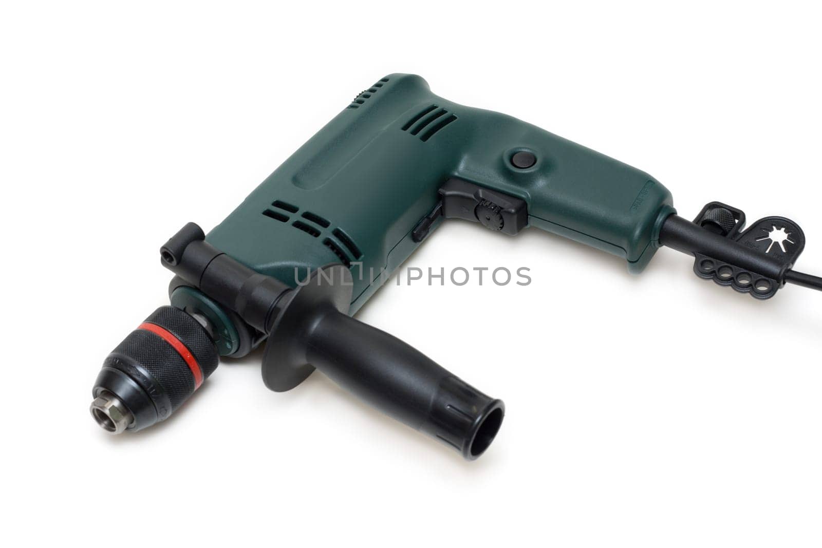Green electric drill with handle and electric wire insulated on white background