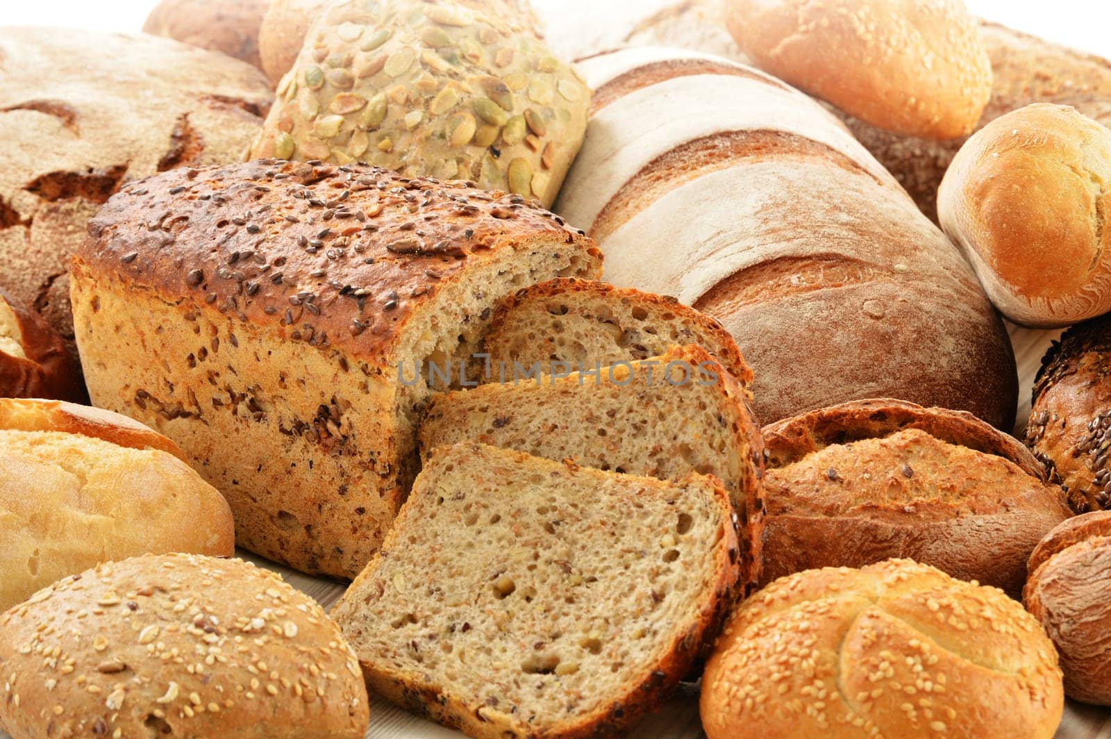 Composition with bread and rolls in wicker basket