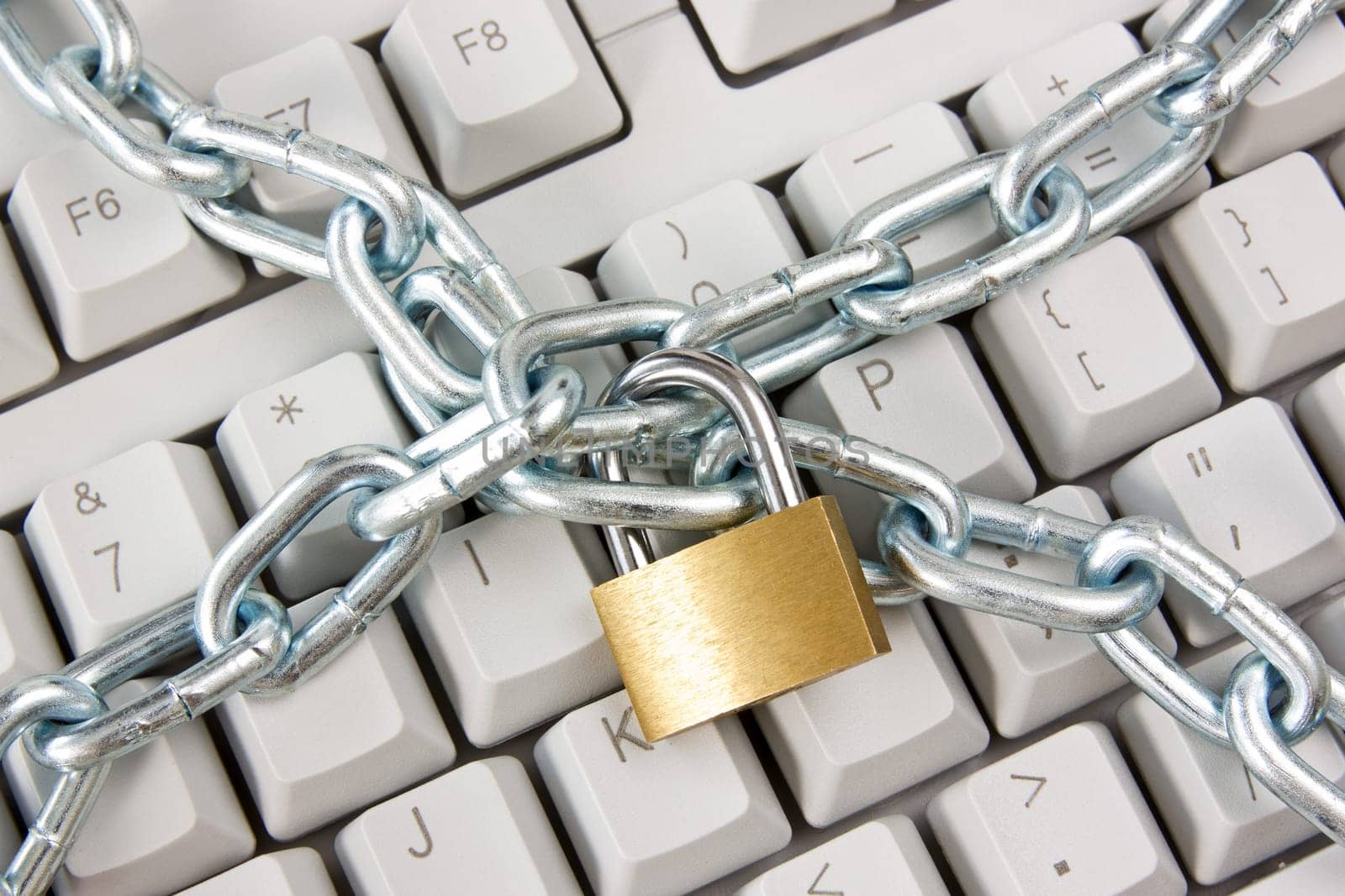 computer  keyboard secured with chain and padlock
