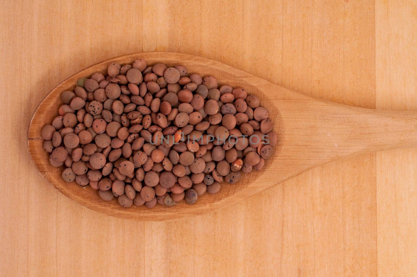 Close-up of organic lentils on a spoon