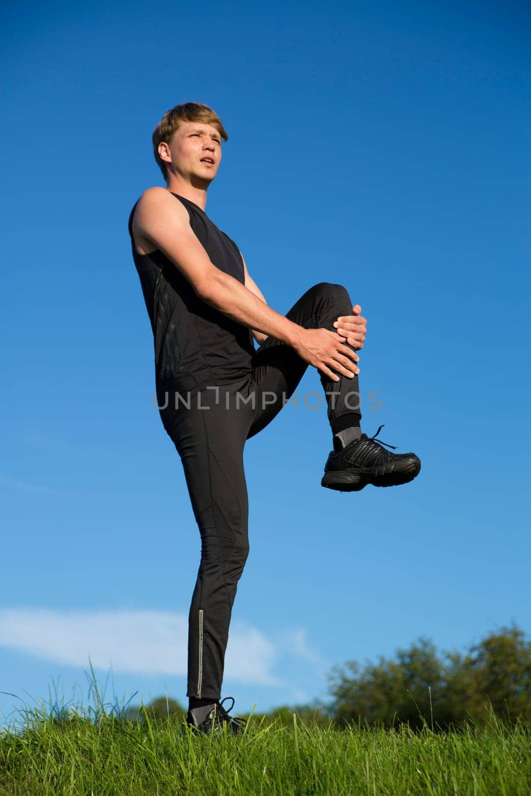 Sportsman is stretch left leg crook on half