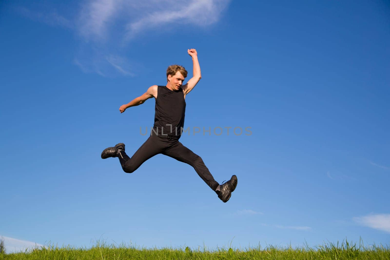 Sportsman making jump from one place to another