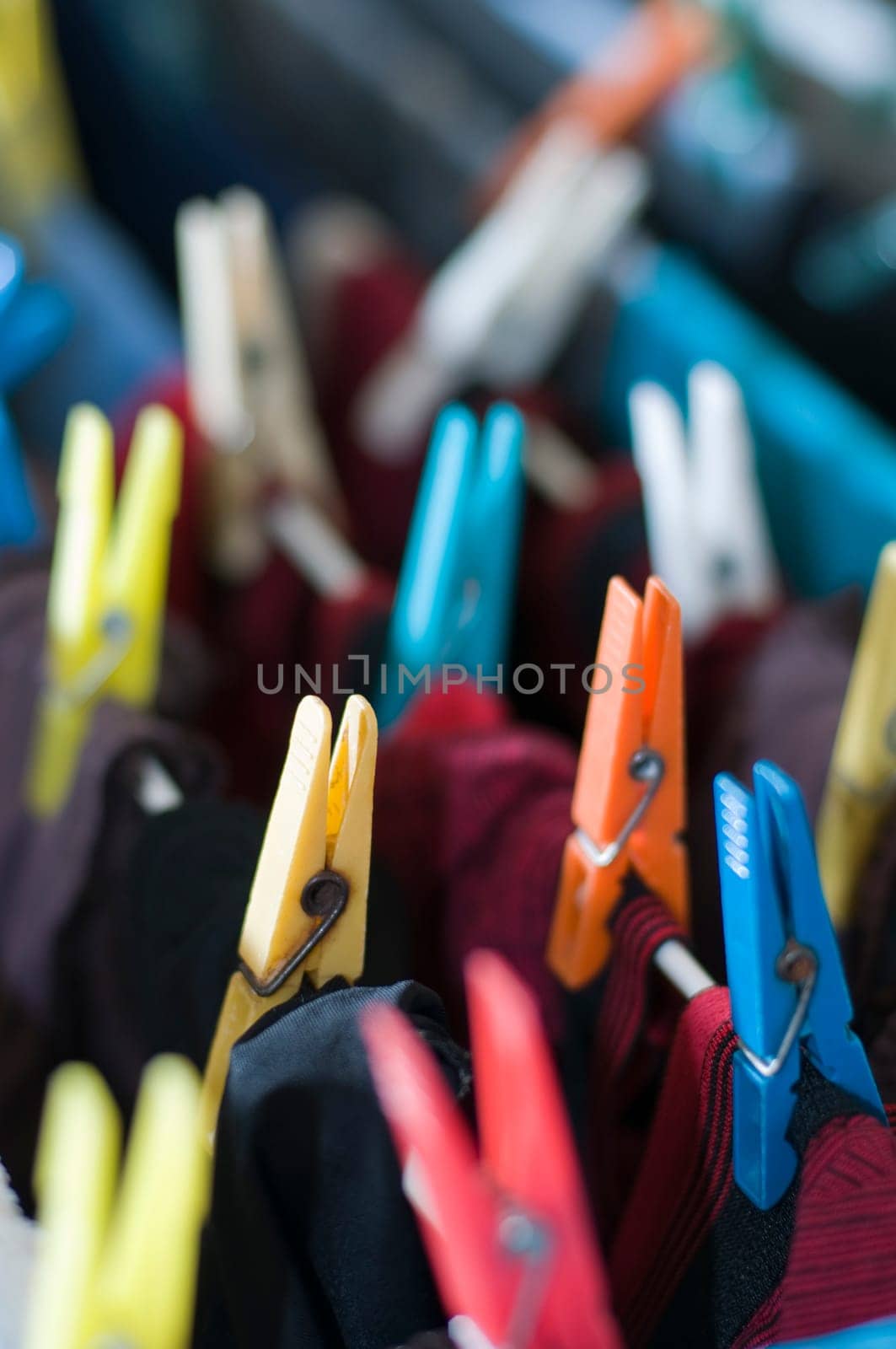 some clothespins on a line with laundry to dry