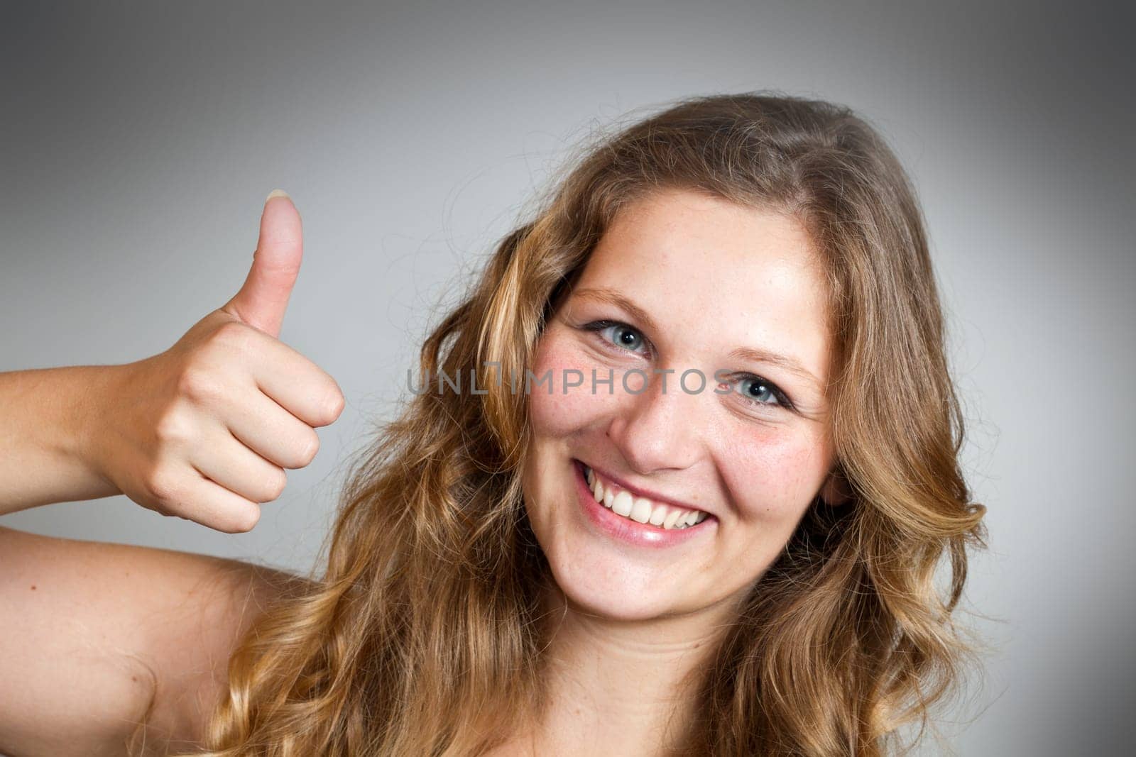 portrait of attractive caucasian smiling woman isolated on white studio