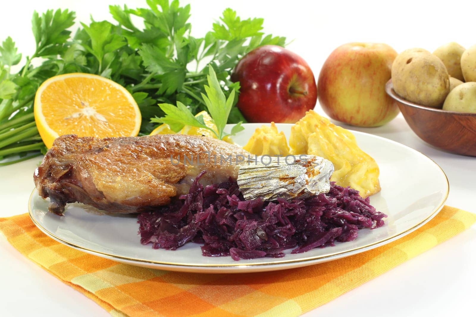 Leg of duck with red cabbage and duchess potatoes