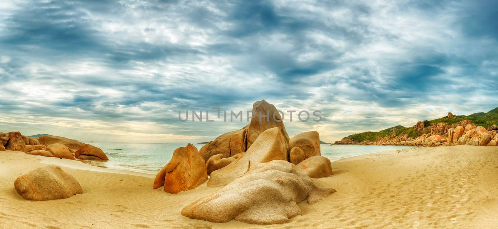 Beautiful beach panorama. Stones on the foreground