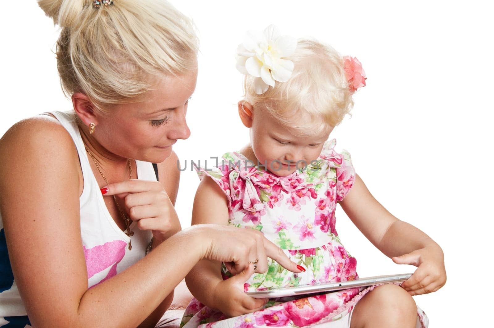 mother and daughter looking tablet, isolated on white