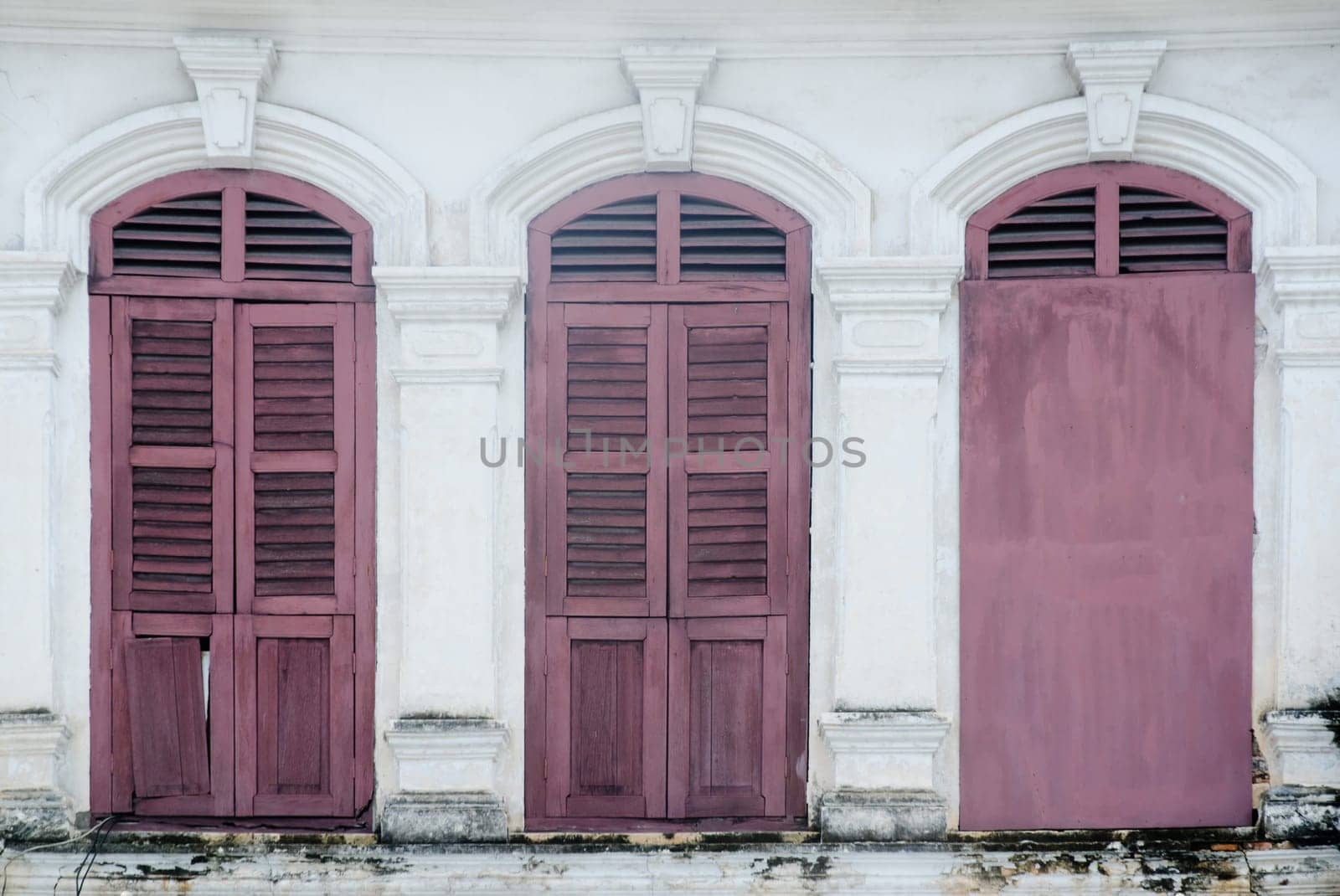old window in phuket, thailand