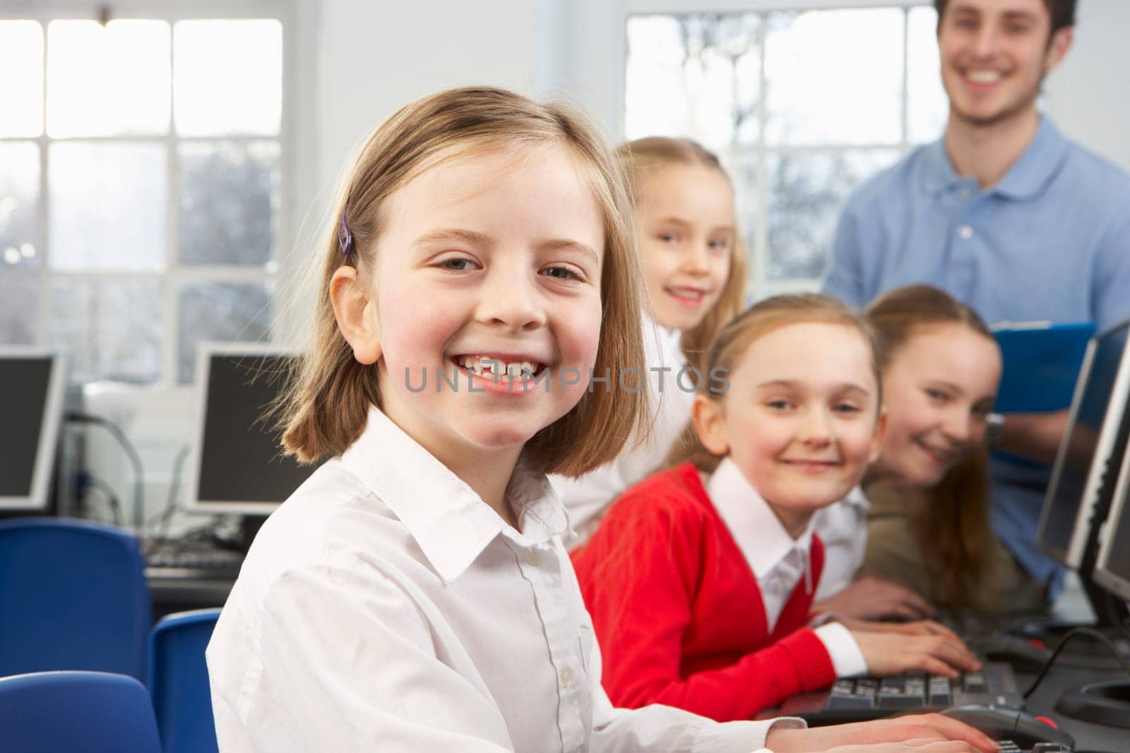 Girls and teacher in school class