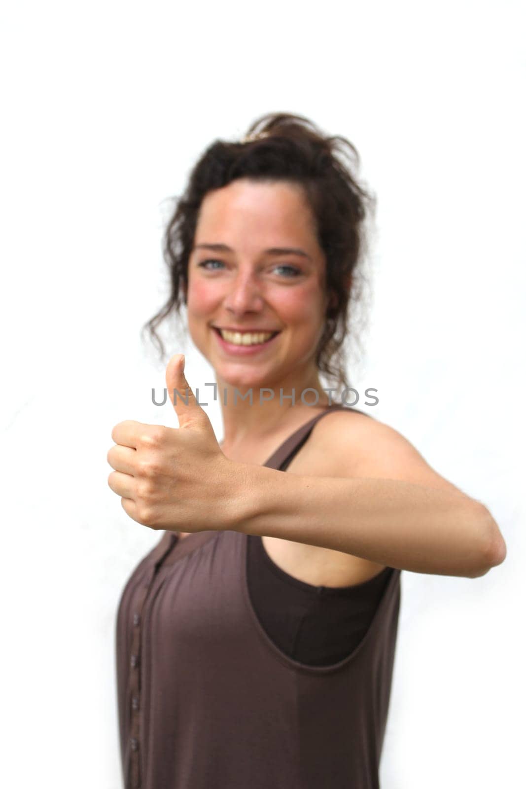 young woman showing thump up