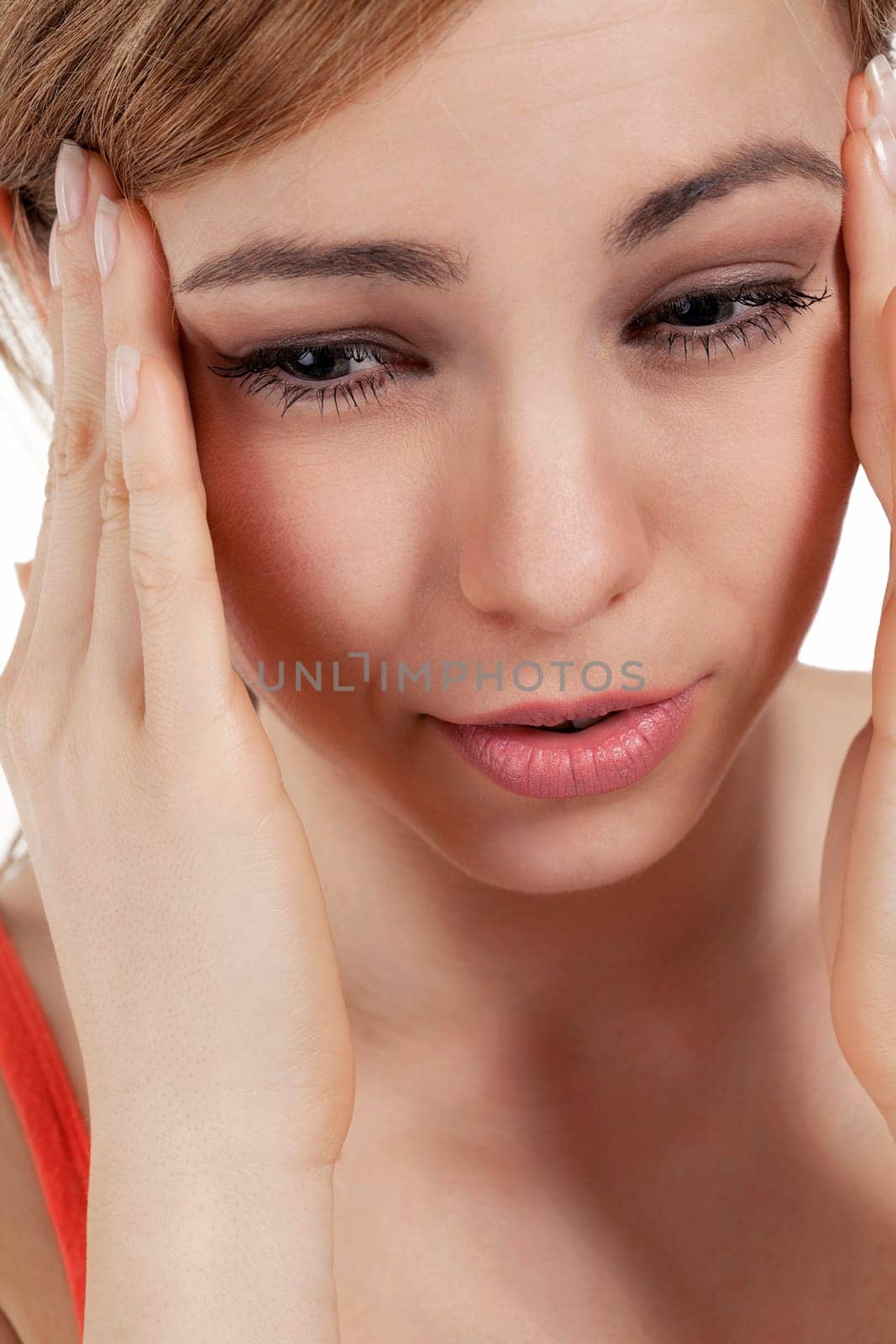 Young pretty blonde woman suffering from headache