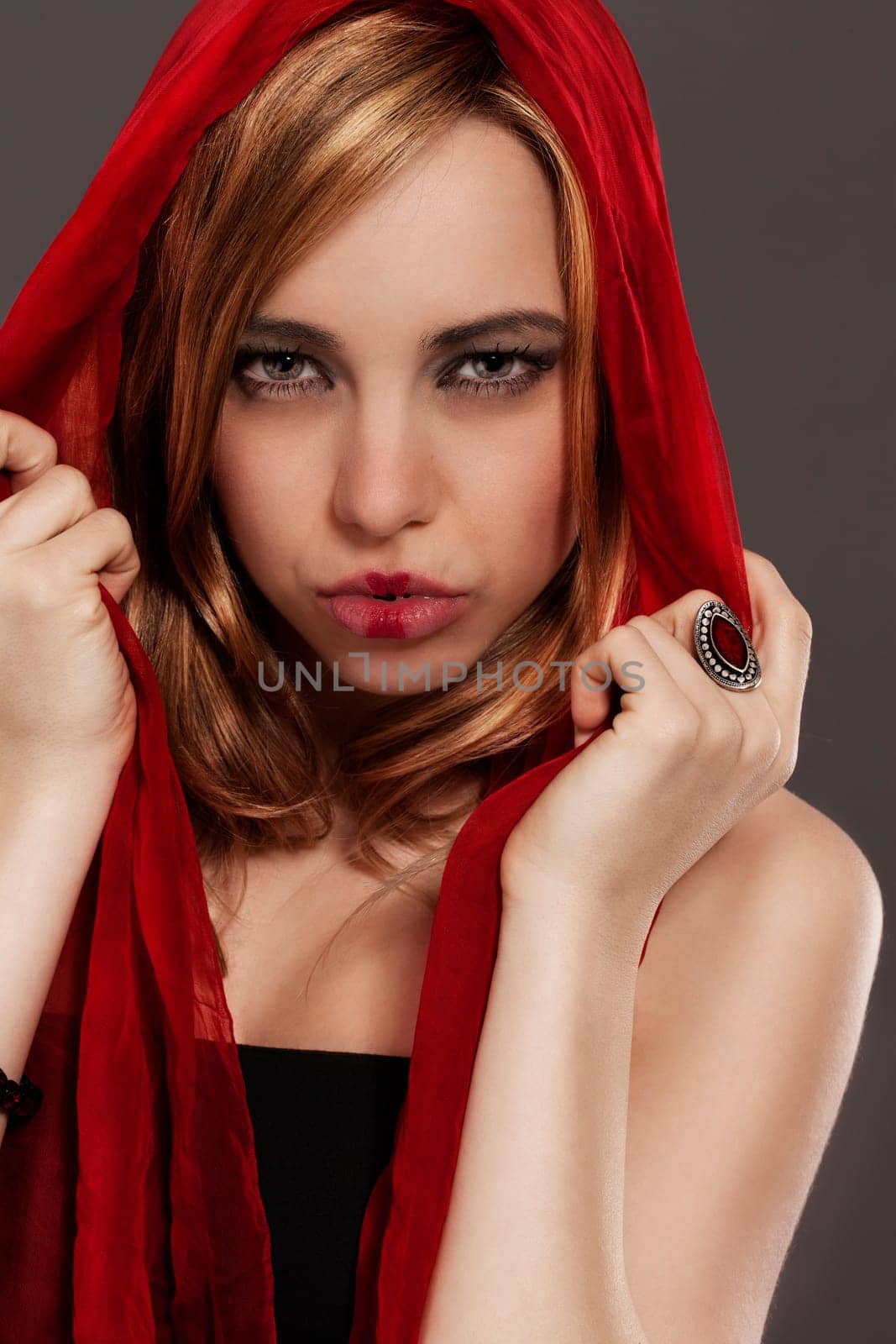 Fantasy portrait of a young woman with red cloth