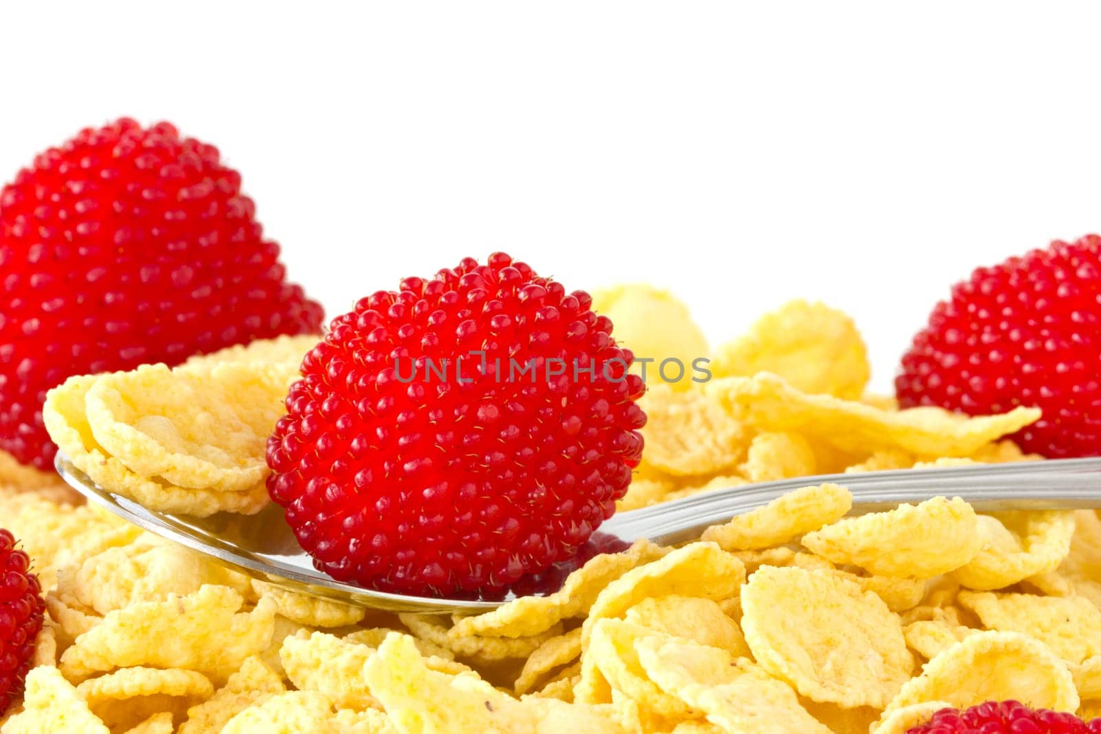 Breakfast cereal with red berries over a white background