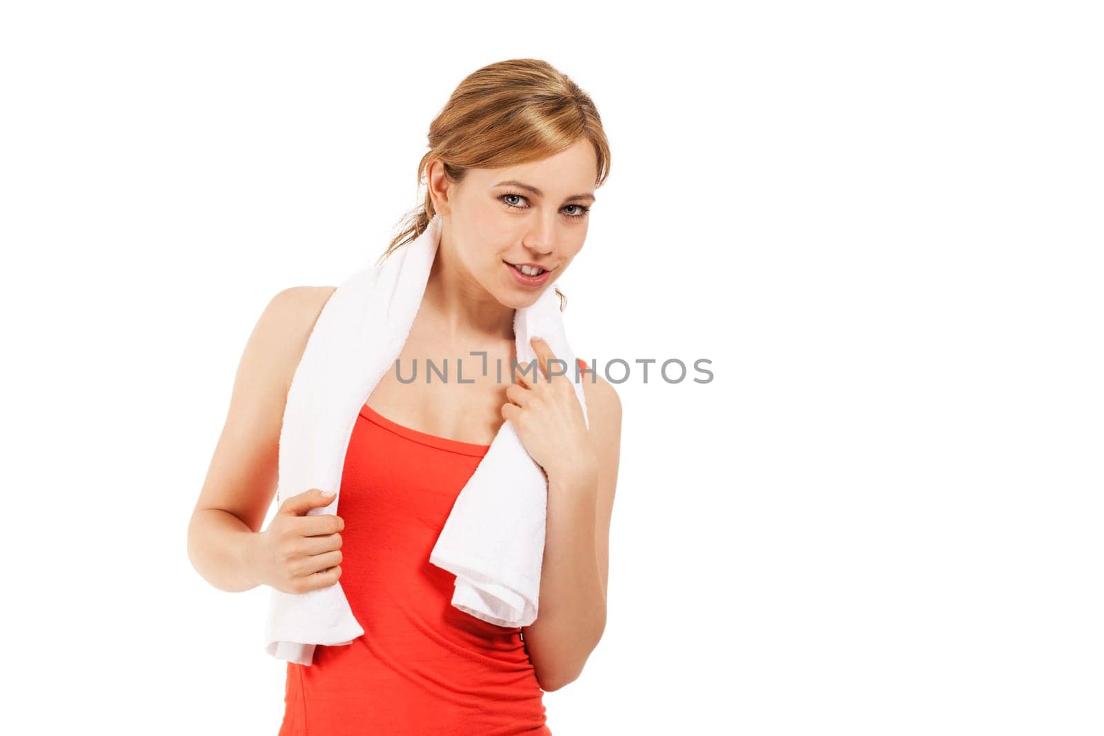 Happy young sportswoman with white towel against white background