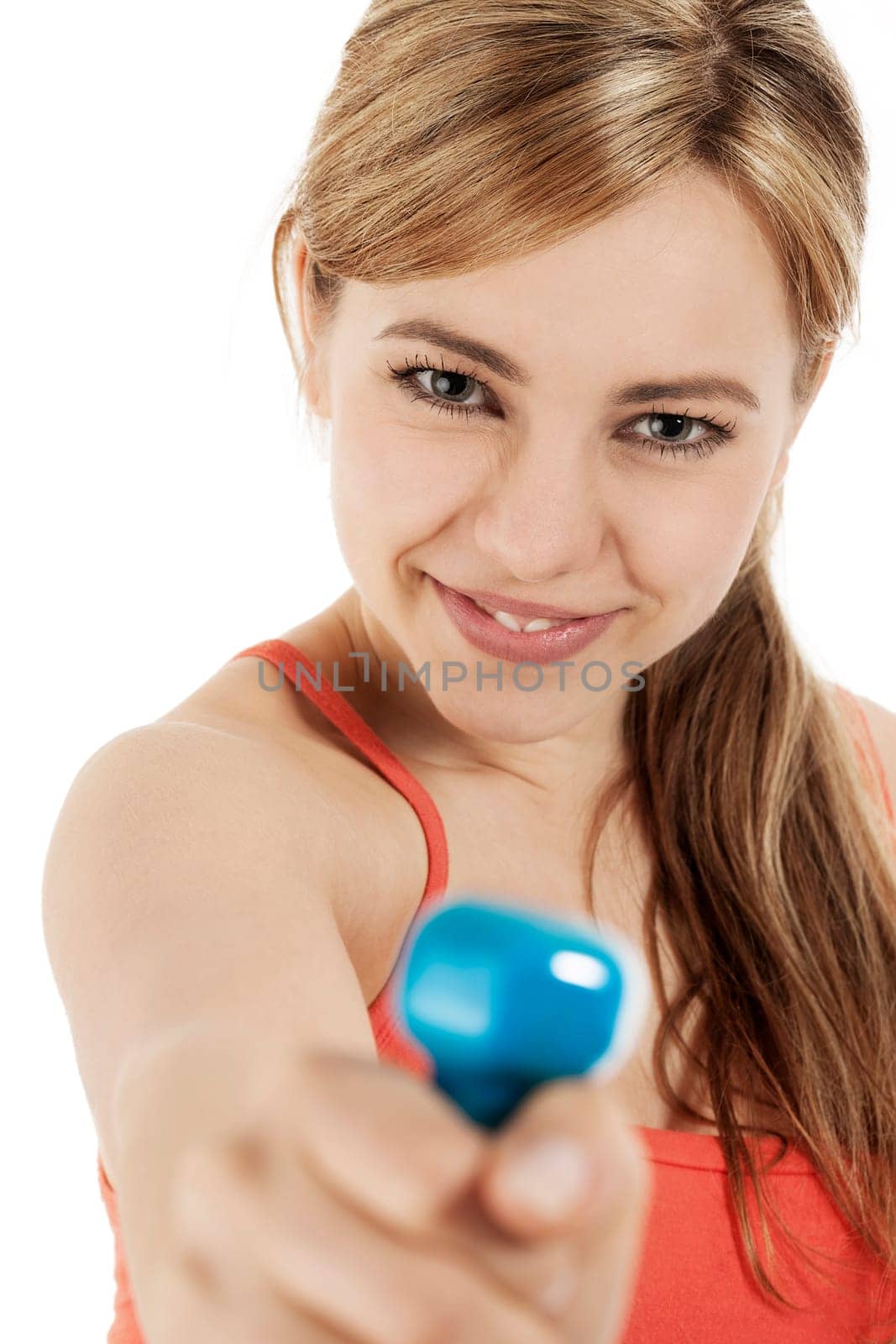 Young happy sportswoman with blue fitness dumbbell against white background