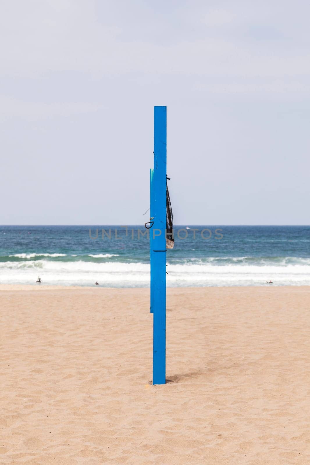 volleyball post at the beach in blue