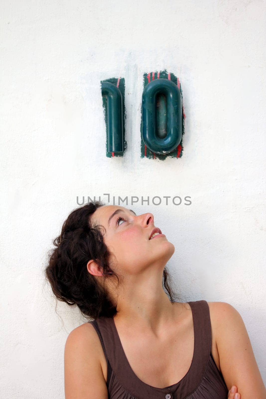 young woman looking at a ten