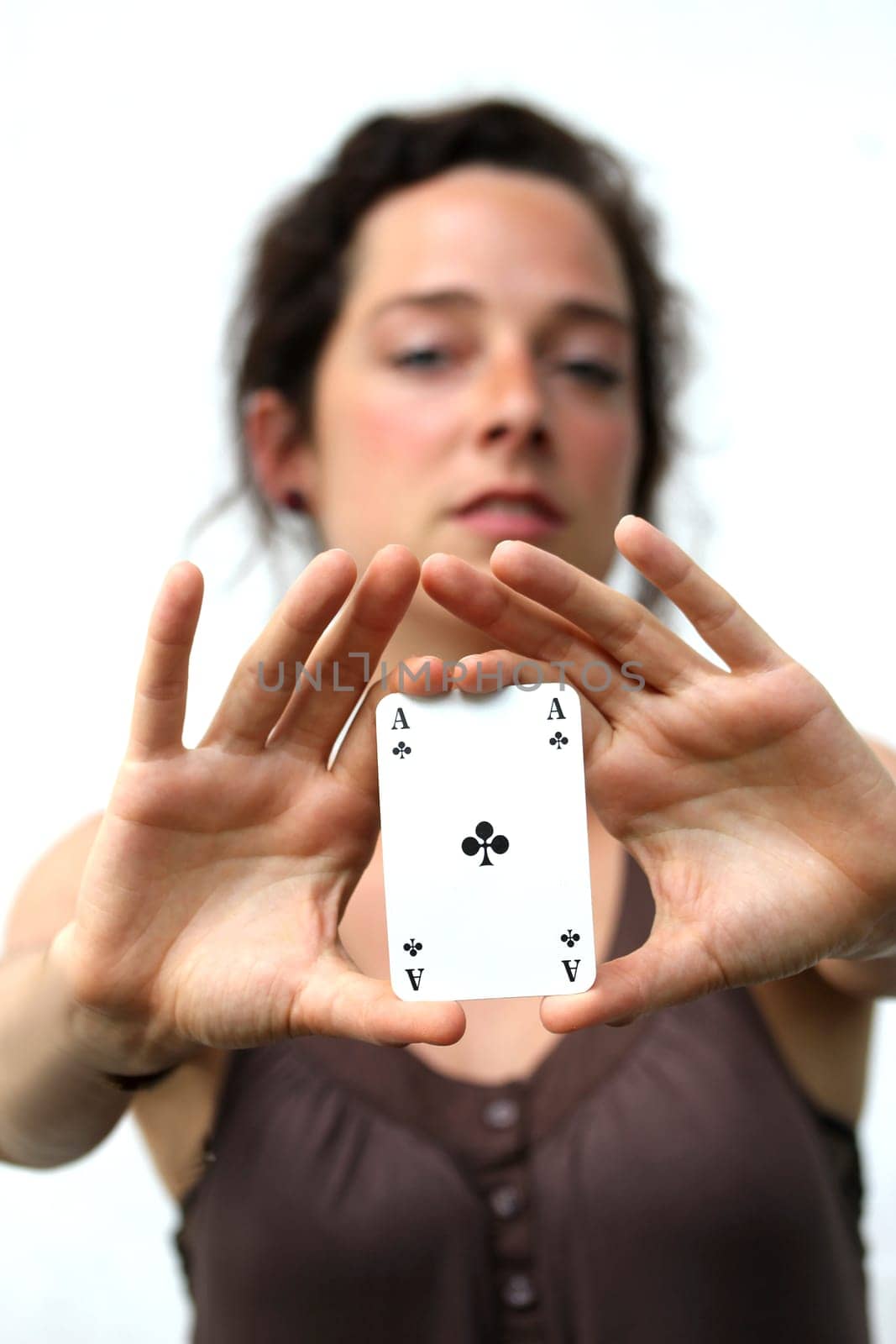young woman holding a ace playing card
