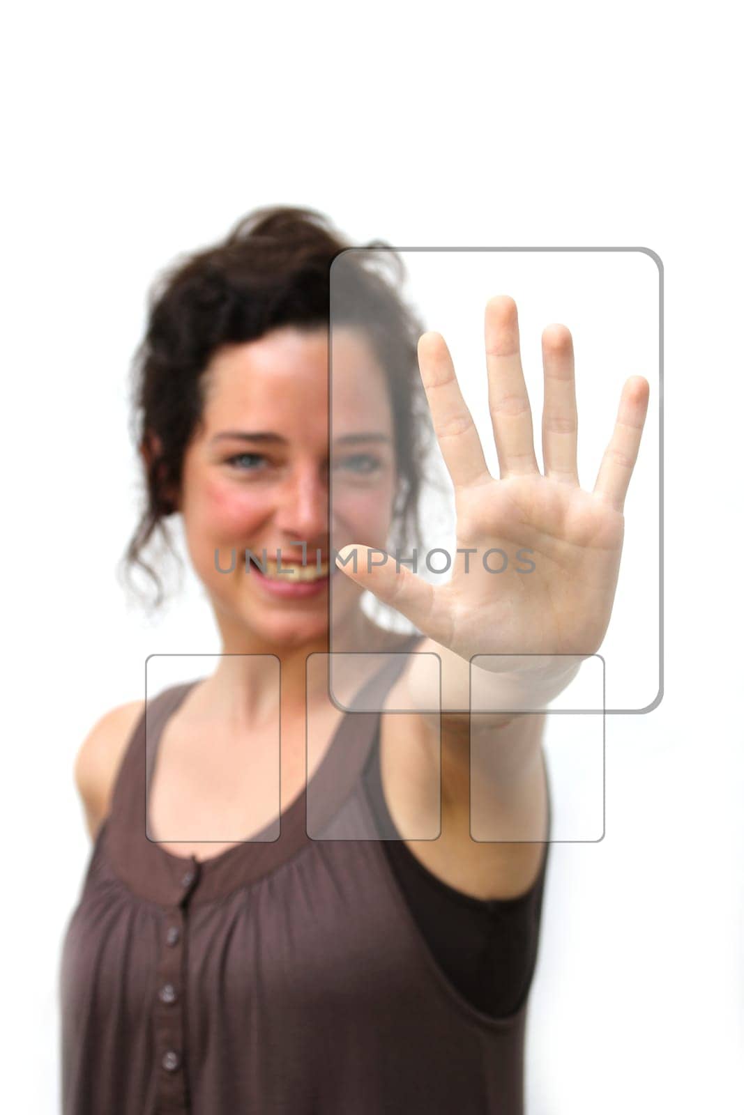 young woman pointing at a digital interface with her left hand