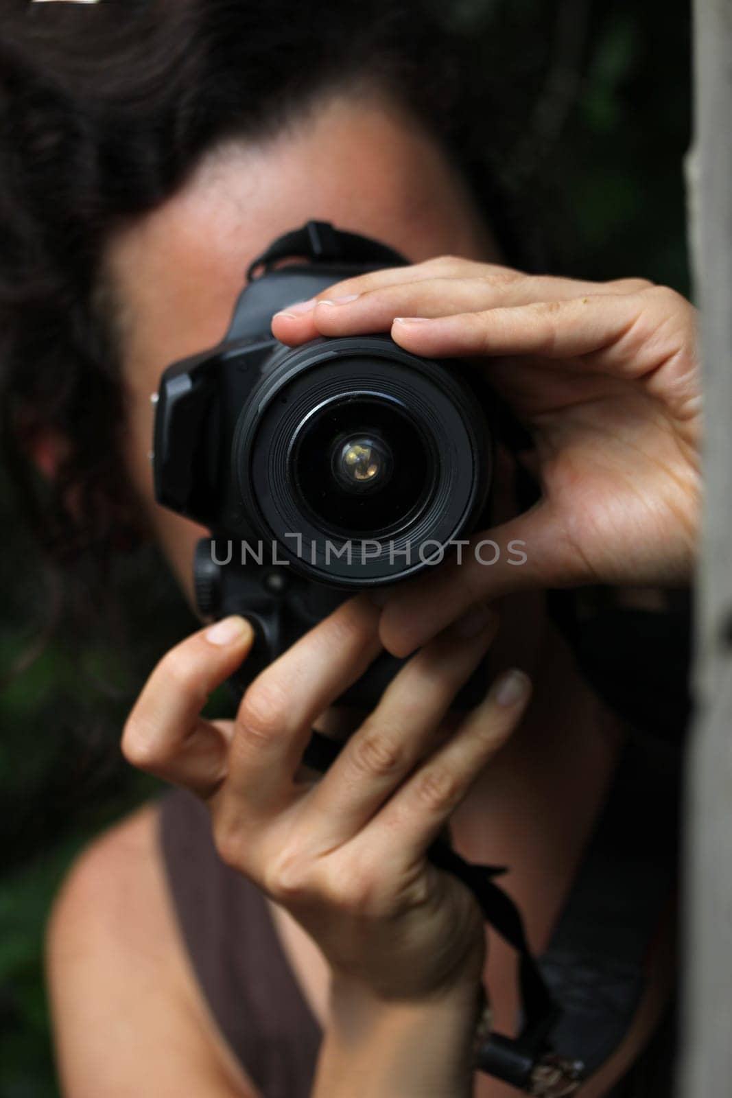 young woman with a dslr camera
