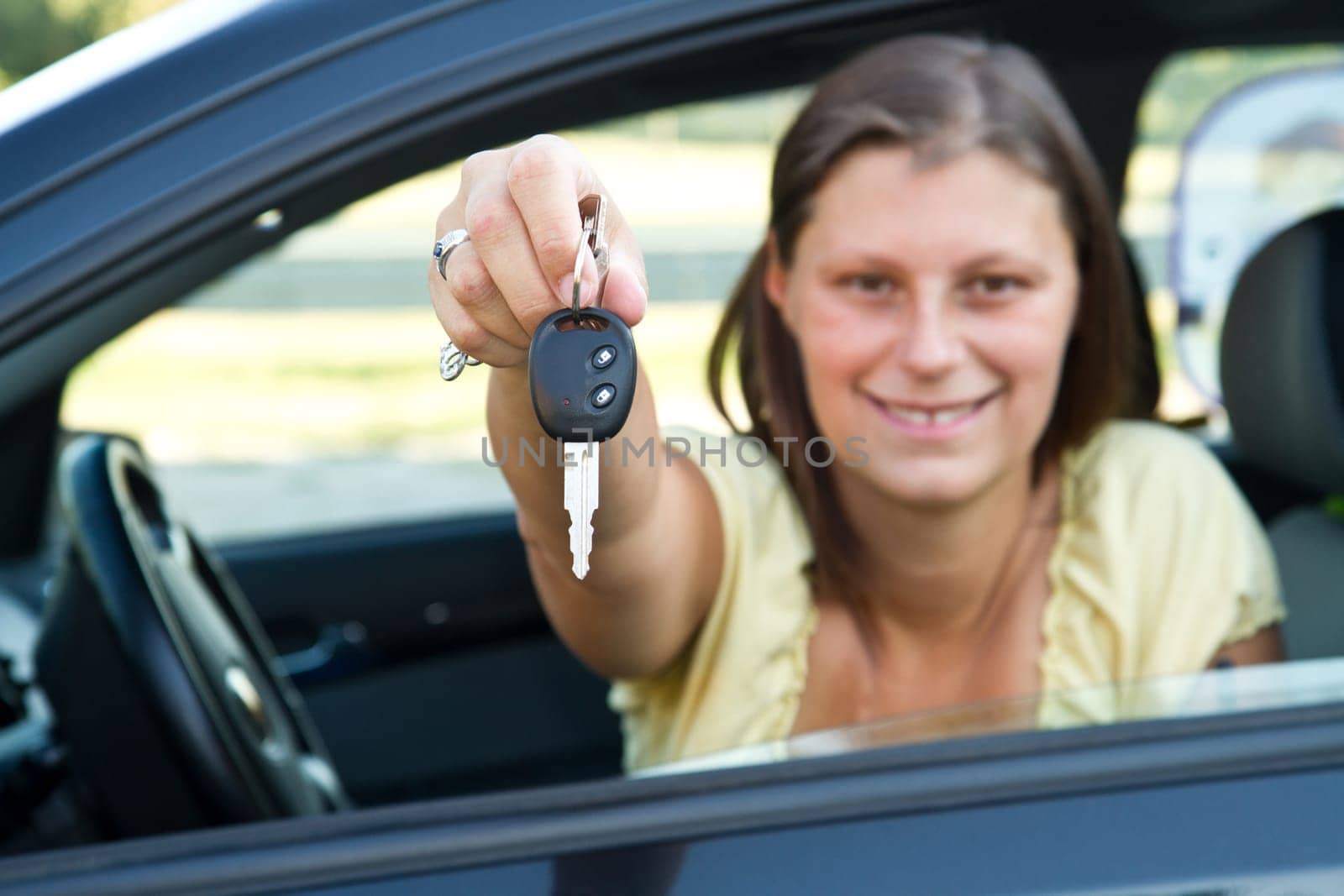 car driver woman smiling showing new car keys