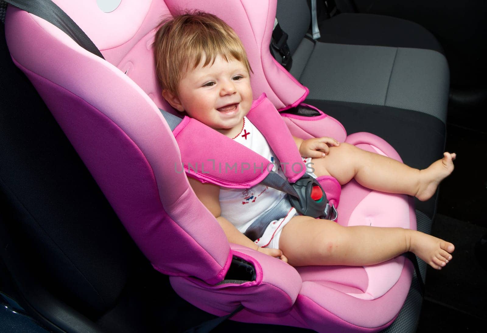 baby in a safety car seat. Safety and security