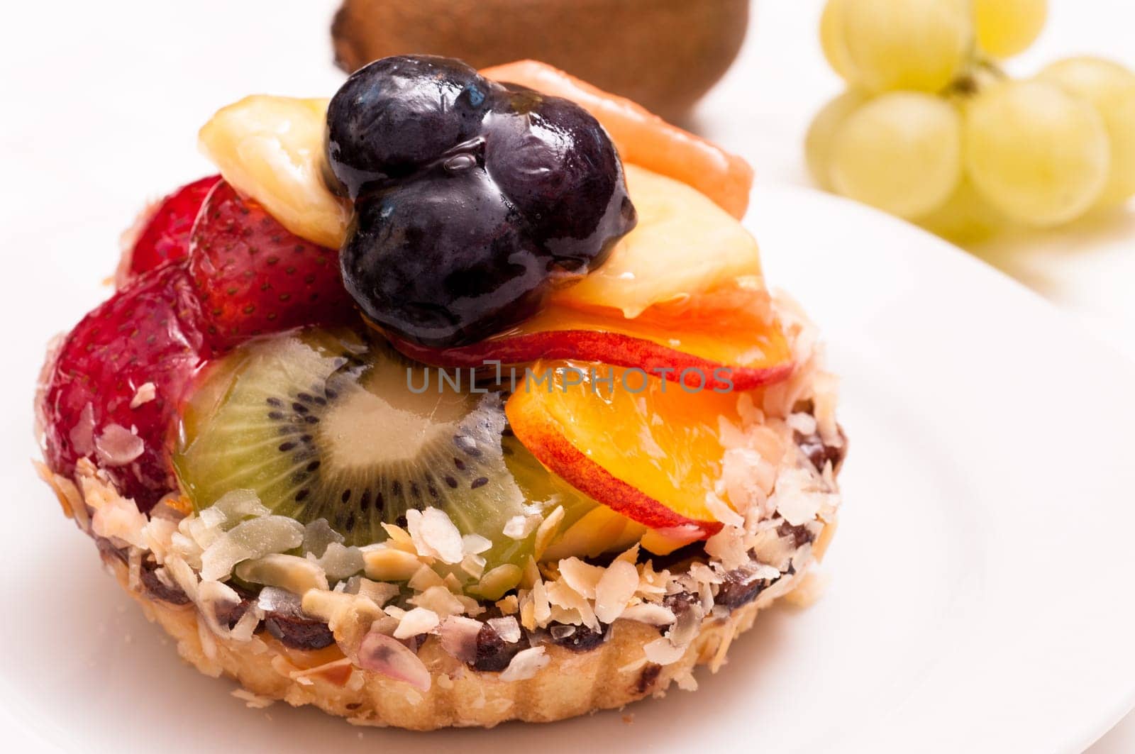 Piece of fruitcake with various fruits
