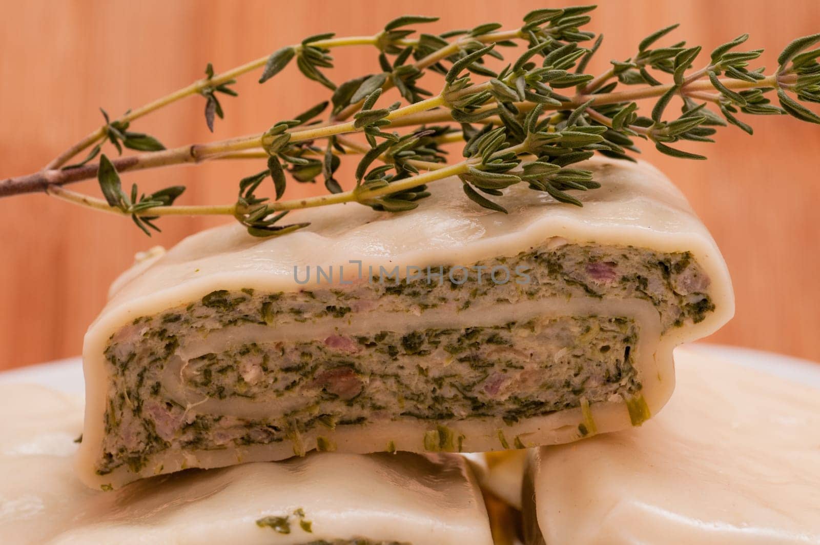 Close-up of a dumpling with thyme