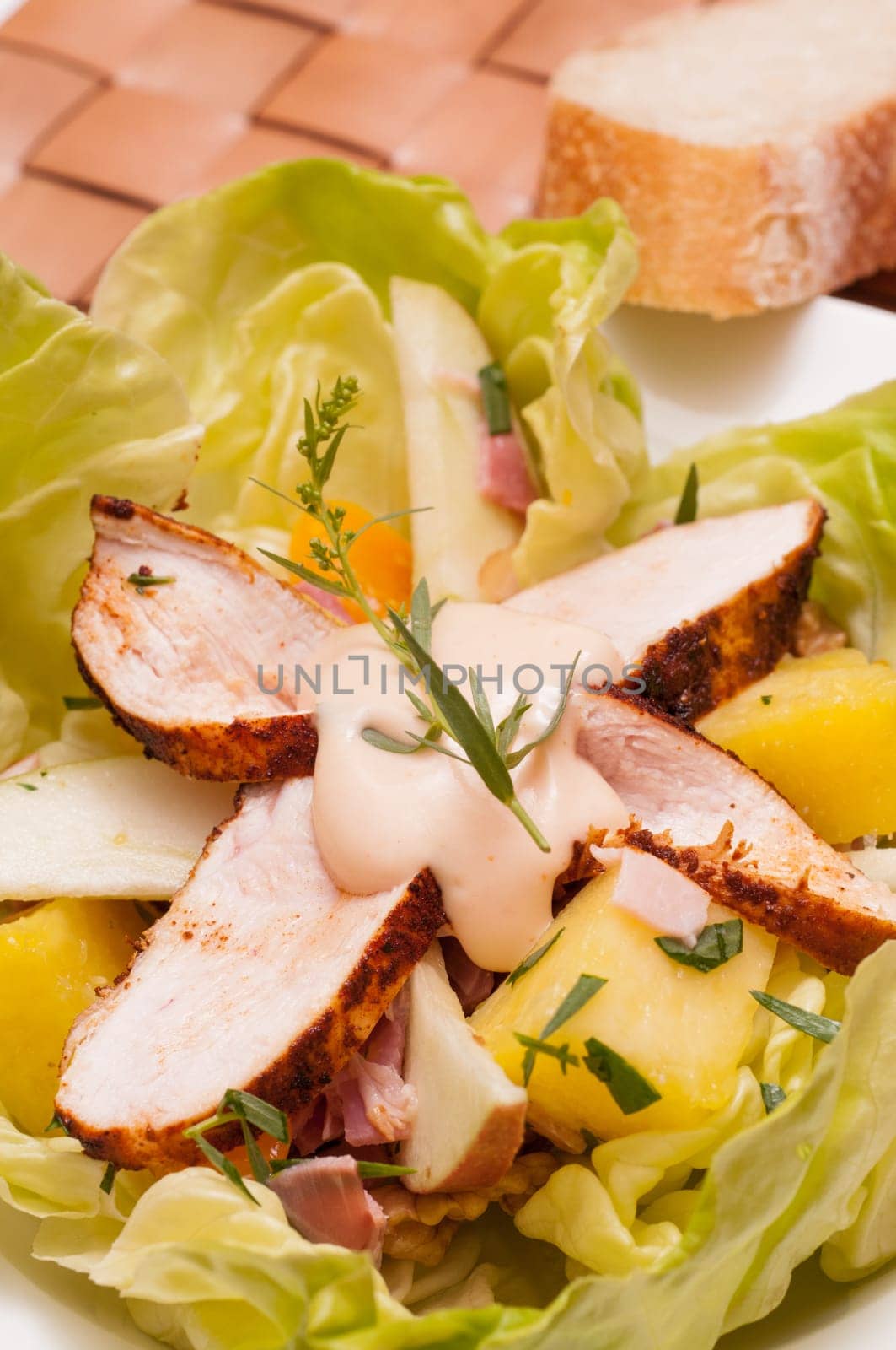Salad with chicken breast,pineapple,apple and cooked ham
