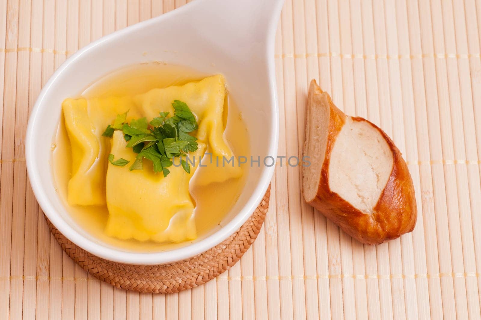 Broth with ravioli as a soup garnish