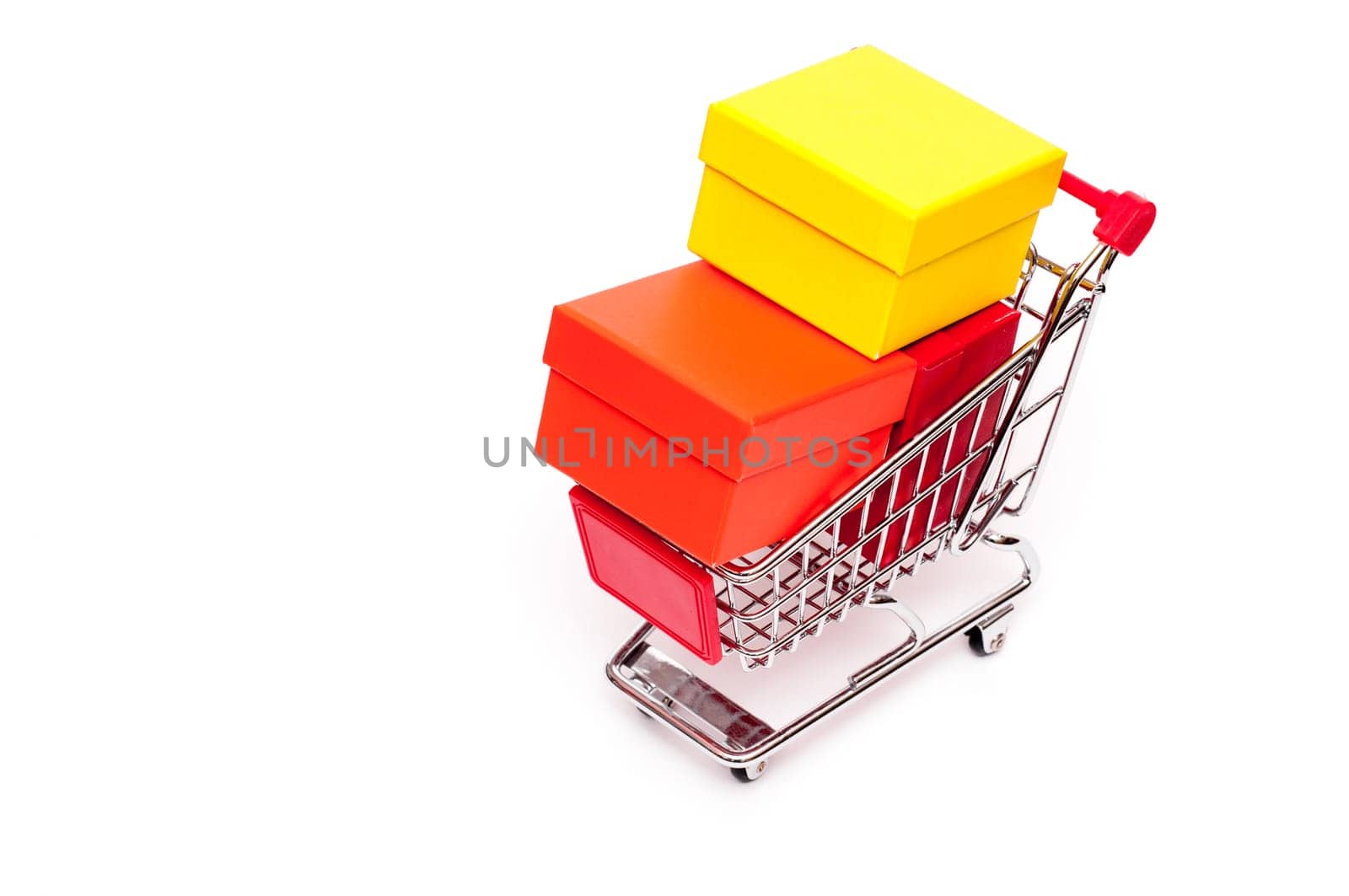 Shopping cart with three gift boxes against white background