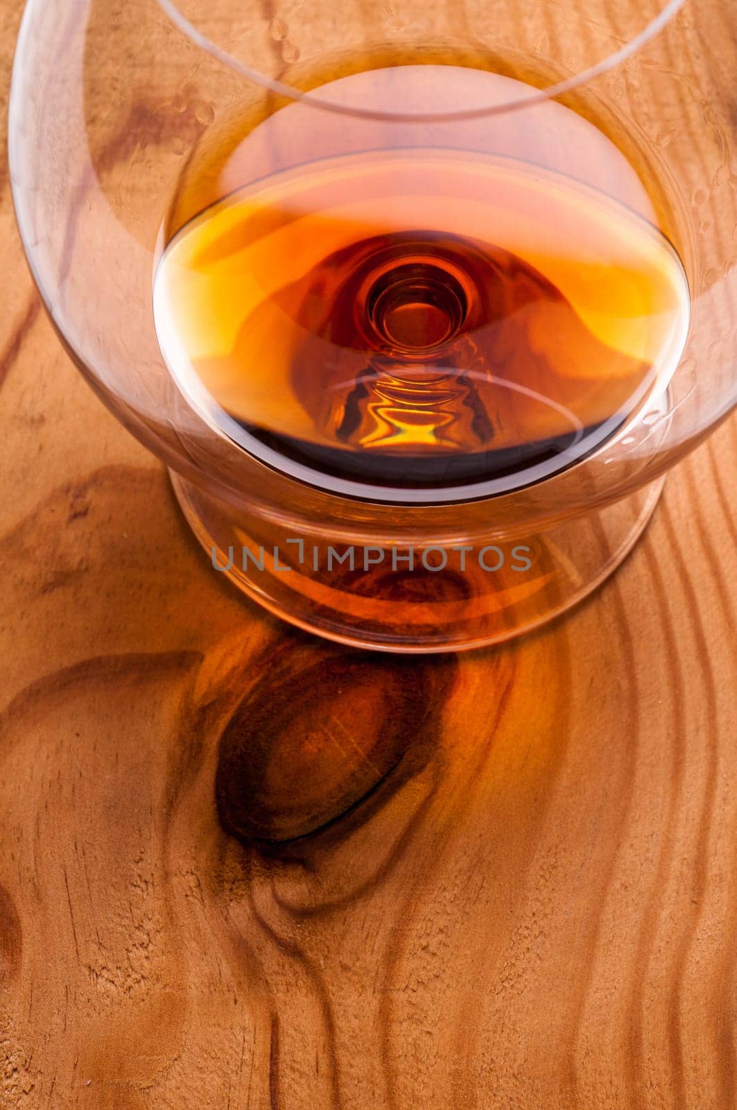 Brandy de Jerez in a glass on a wooden board