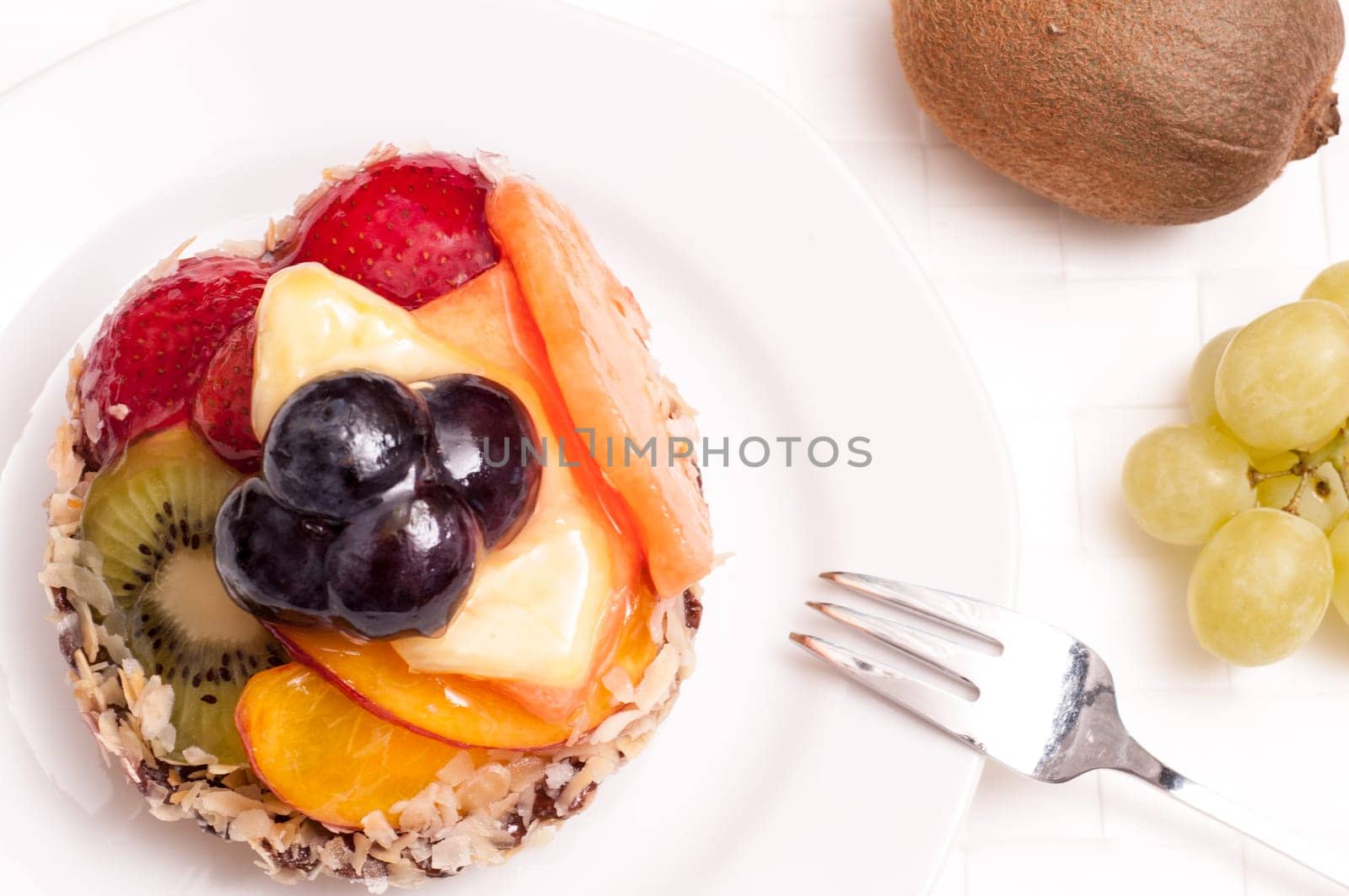 Fruitcake with fork on a plate