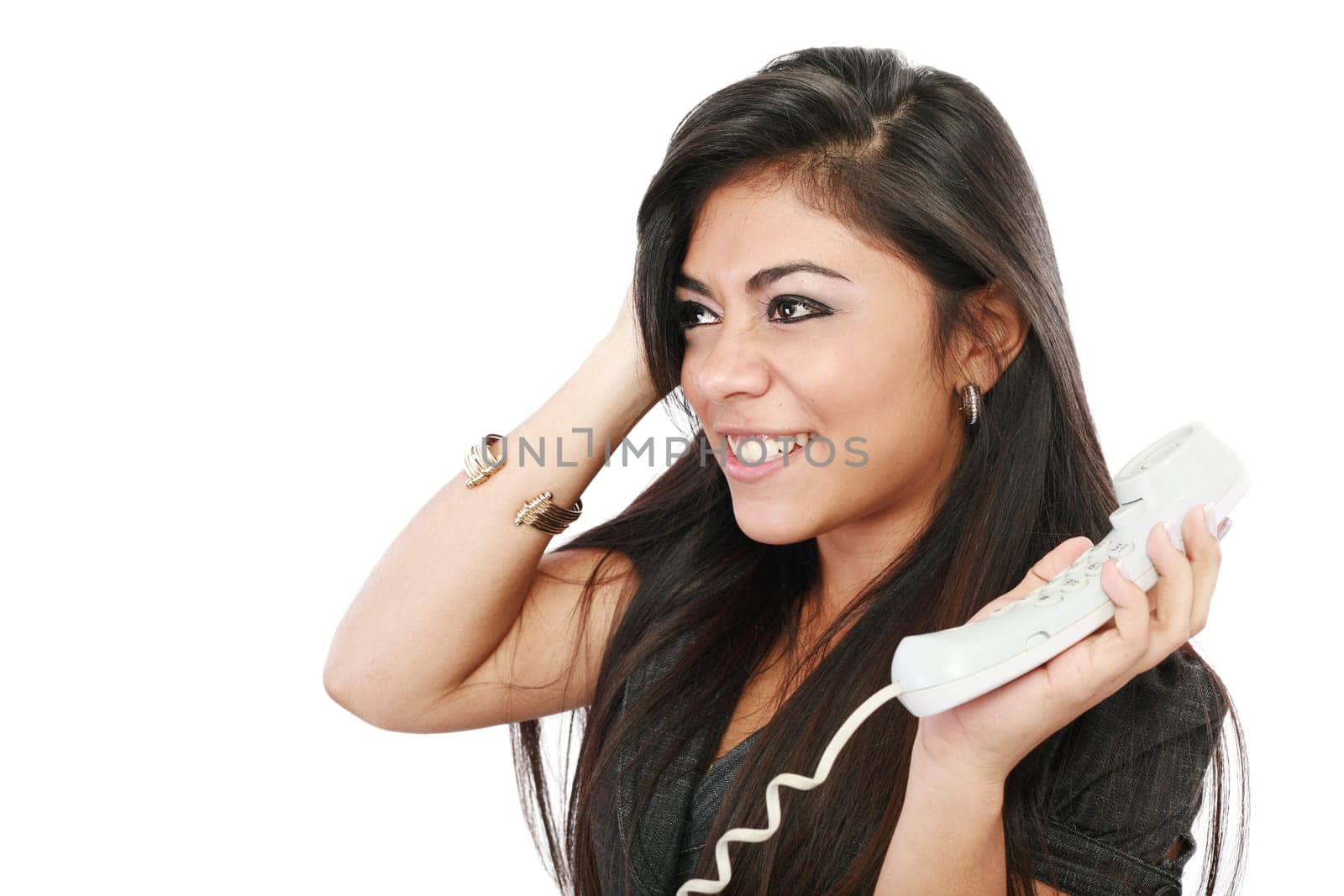 Frustrated businesswoman talking on phone against a white background