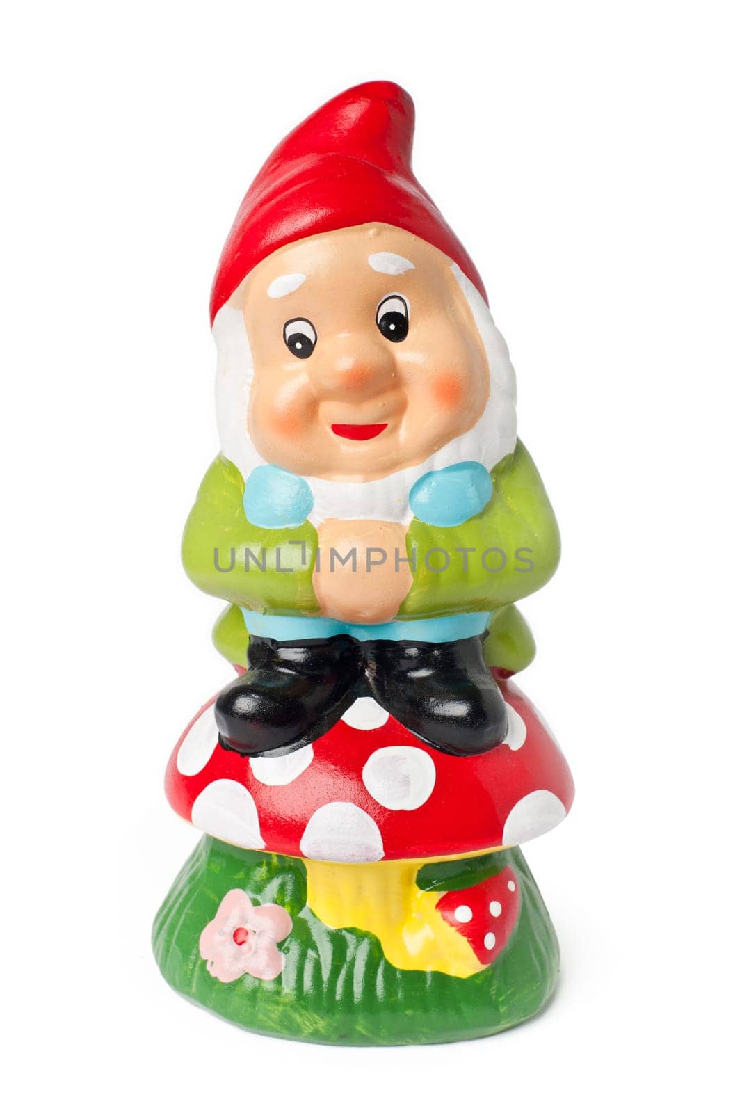Garden gnome on a mushroom isolated on white