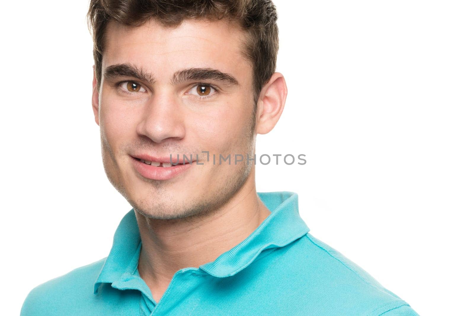 Portrait of a young man against a white studio background
