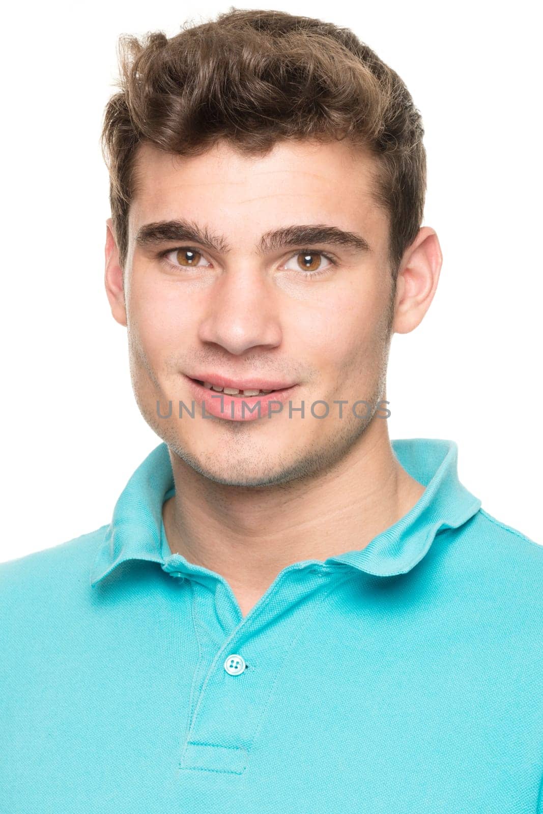 Portrait of a young man against a white studio background