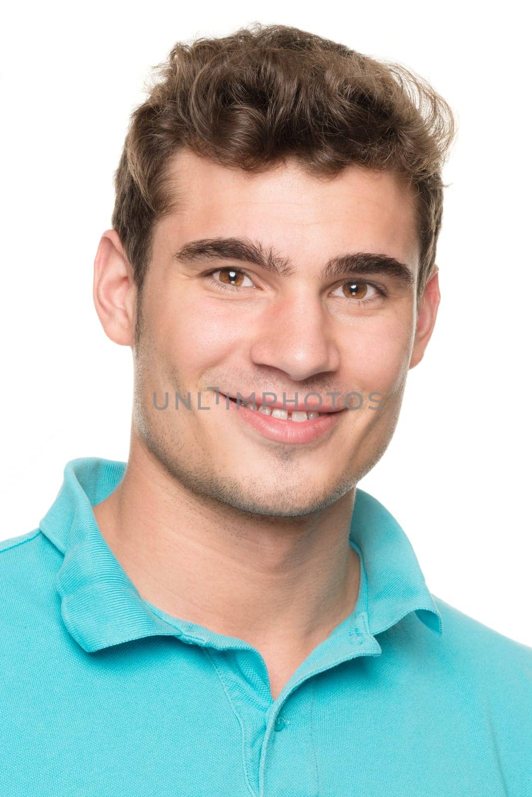 Portrait of a young man against a white studio background