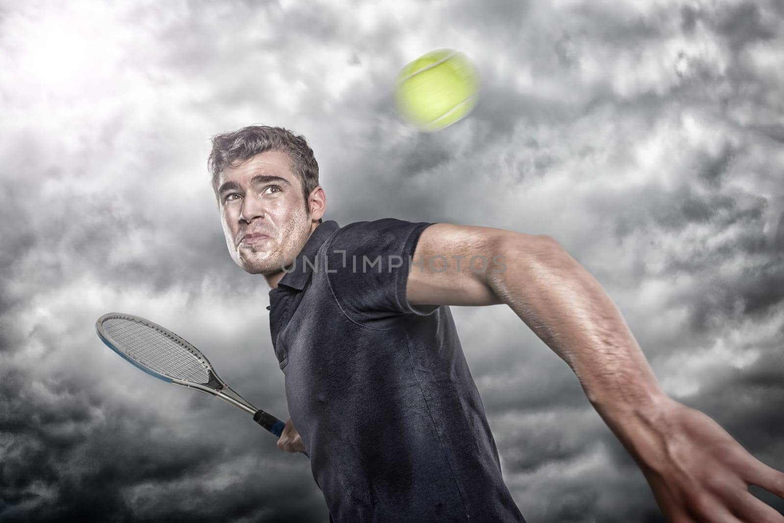 Young tennis player in front of dramatic sky
