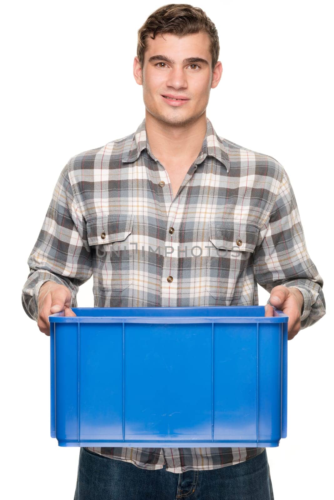 Young man with a blue box against a white studio background
