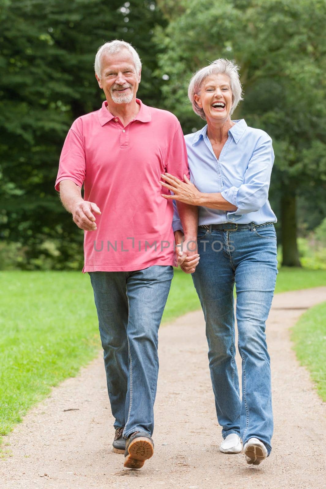 Attractive retired couple on a trip in a park
